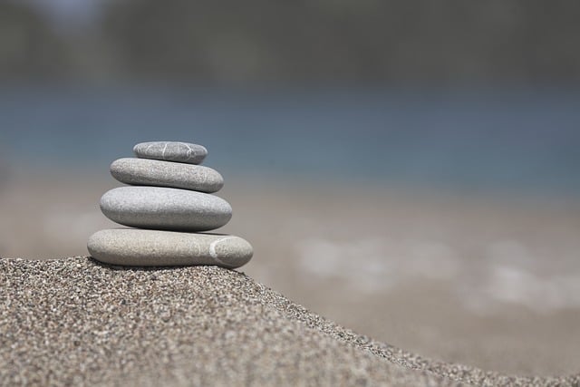 A stack of historical maritime logbooks and charts in a research archive